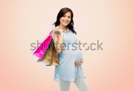 Felice donna incinta gravidanza vendita maternità Foto d'archivio © dolgachov