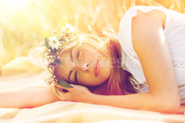 happy woman in wreath of flowers on cereal field Stock photo © dolgachov
