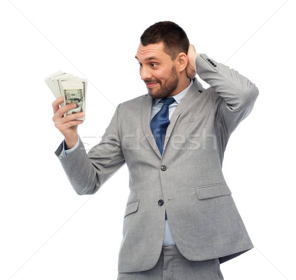 smiling businessman with american dollar money Stock photo © dolgachov