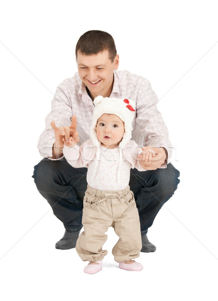 baby making first steps with father help Stock photo © dolgachov