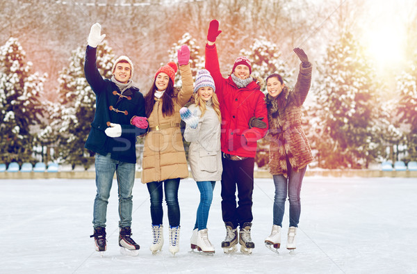 Boldog barátok korcsolyázás pálya kint emberek Stock fotó © dolgachov