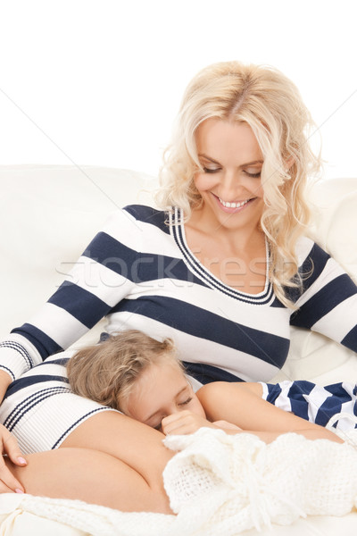 happy mother and sleeping girl Stock photo © dolgachov