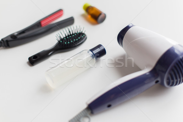 hairdryer, brush, hot styling hair spray and iron Stock photo © dolgachov