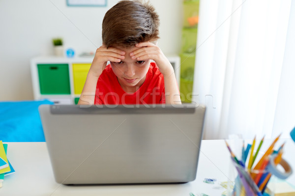 Cansado estudante menino computador portátil casa educação Foto stock © dolgachov