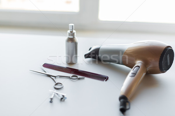 hairdryer, scissors, comb and styling hair spray Stock photo © dolgachov