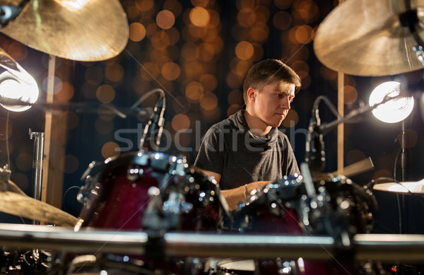 male musician playing drum kit at concert Stock photo © dolgachov