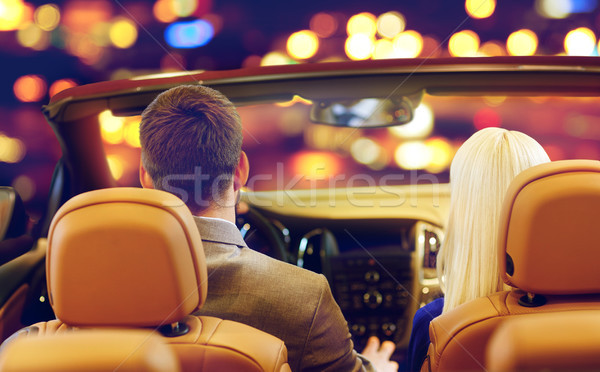 close up of couple driving in convertible car Stock photo © dolgachov