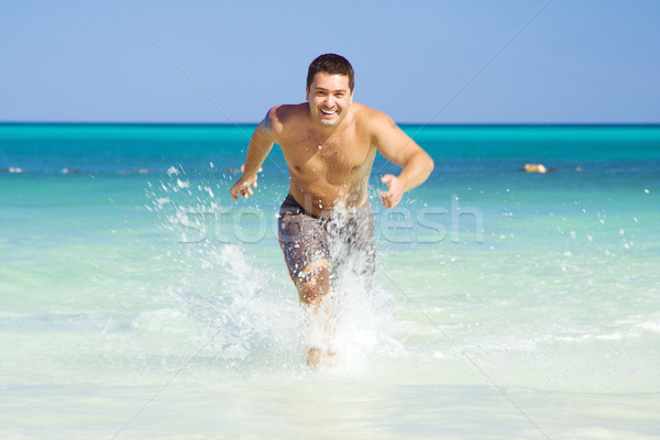 running out of the ocean Stock photo © dolgachov