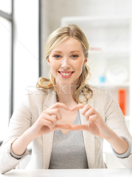 young woman showing heart sign Stock photo © dolgachov