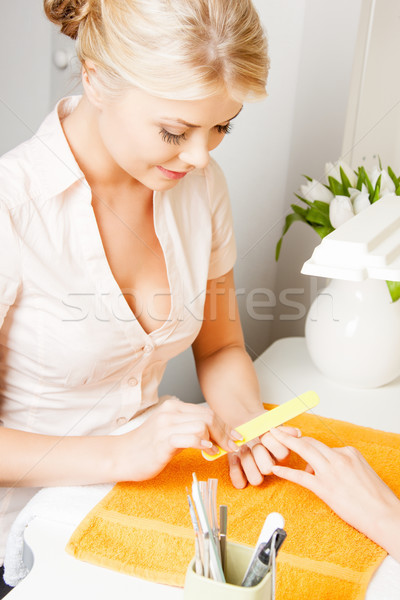 woman having a manicure at the salon Stock photo © dolgachov