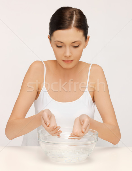woman washing her face Stock photo © dolgachov