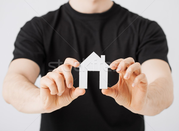 Stock photo: man hands holding paper house