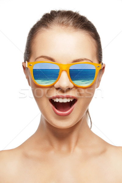 amazed girl in shades Stock photo © dolgachov