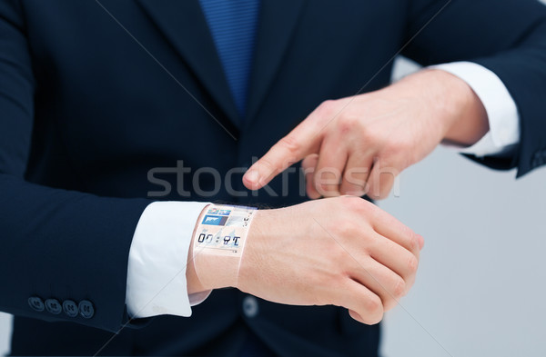 Stockfoto: Zakenman · wijzend · iets · hand · tijd · business