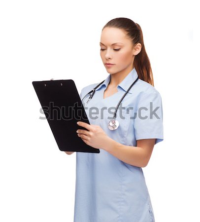 serious female doctor or nurse with stethoscope Stock photo © dolgachov