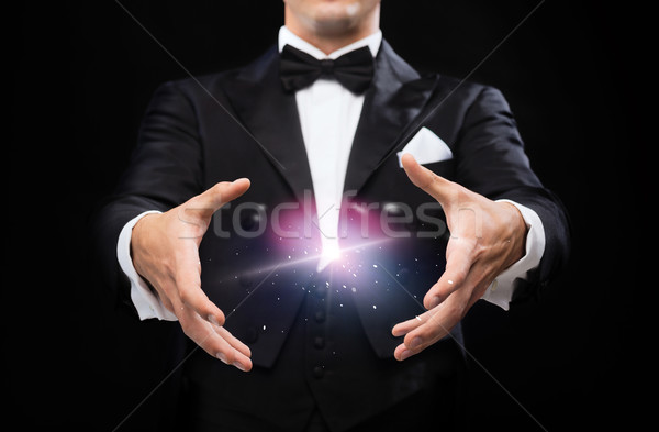 magician in top hat showing trick Stock photo © dolgachov