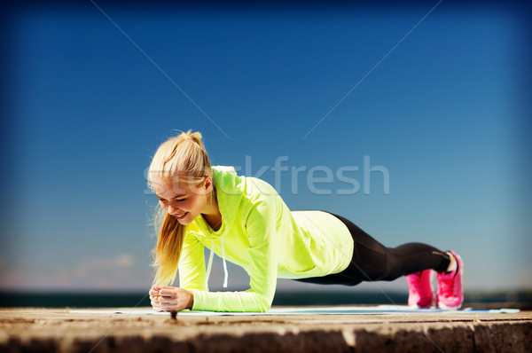 woman doing sports outdoors Stock photo © dolgachov