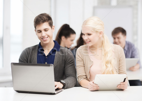 Zwei lächelnd Studenten Laptop Bildung Stock foto © dolgachov