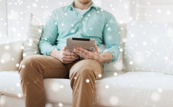 close up of man with tablet pc computer at home Stock photo © dolgachov