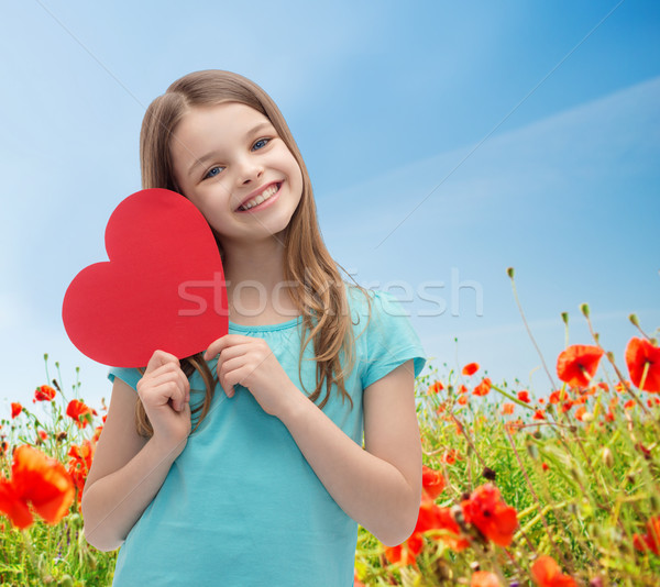 Sorridente little girl vermelho coração amor caridade Foto stock © dolgachov