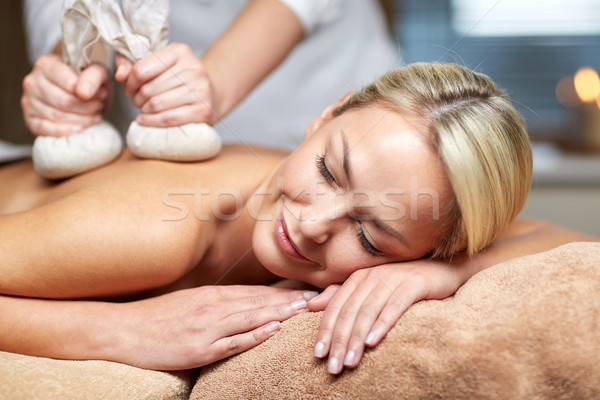 close up of woman lying on massage table in spa Stock photo © dolgachov