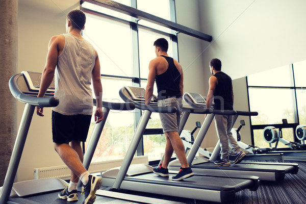 Férfiak testmozgás futópad tornaterem sport fitnessz Stock fotó © dolgachov