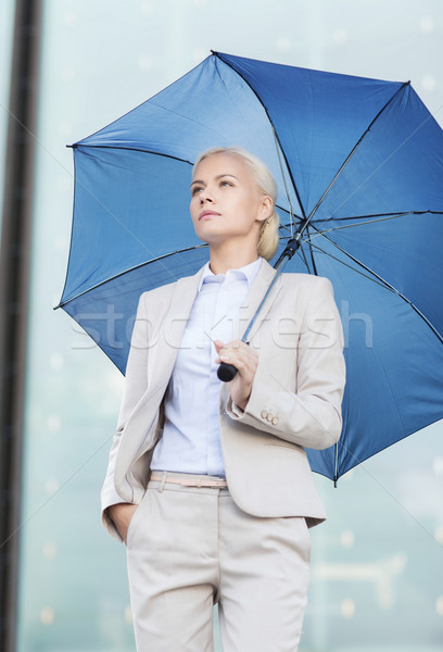 Stockfoto: Jonge · ernstig · zakenvrouw · paraplu · buitenshuis · business