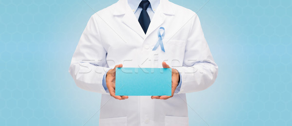 doctor with prostate cancer awareness ribbon Stock photo © dolgachov