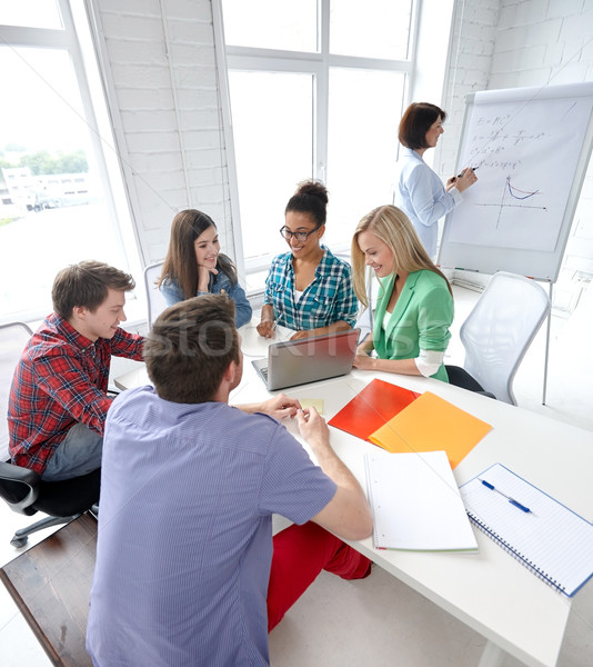 group of happy high school students with workbook Stock photo © dolgachov