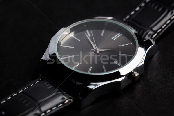 close up of black classic male wristwatch Stock photo © dolgachov