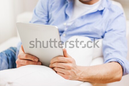 close up of man working with tablet pc at home Stock photo © dolgachov