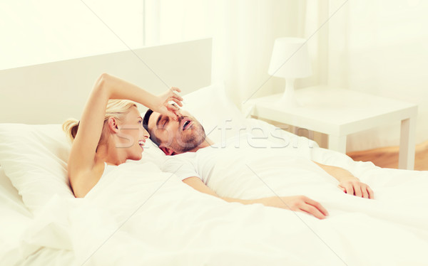 Gelukkig paar slapen bed home mensen Stockfoto © dolgachov