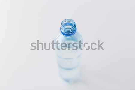 close up of bottle with drinking water on table Stock photo © dolgachov