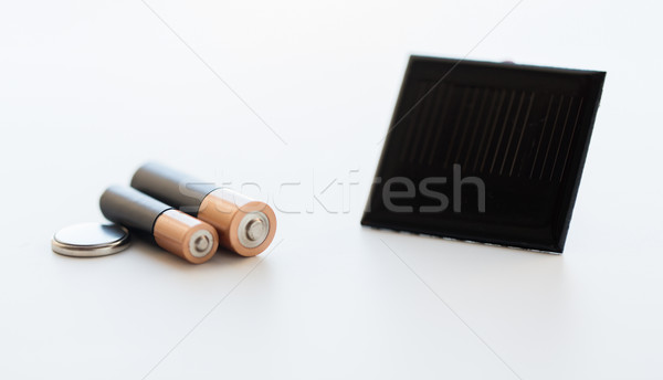 close up of alkaline batteries and solar cell Stock photo © dolgachov