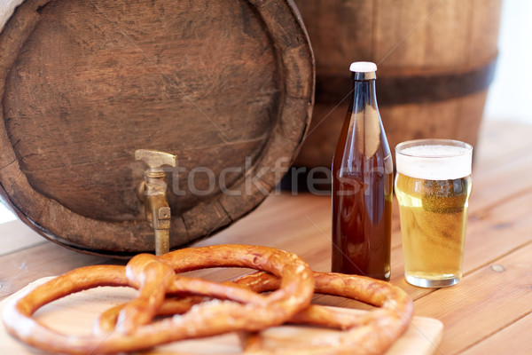 close up of beer barrel, glass, pretzel and bottle Stock photo © dolgachov