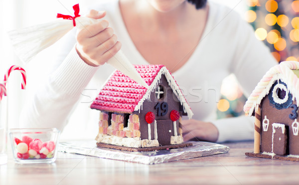 close up of woman making gingerbread houses Stock photo © dolgachov