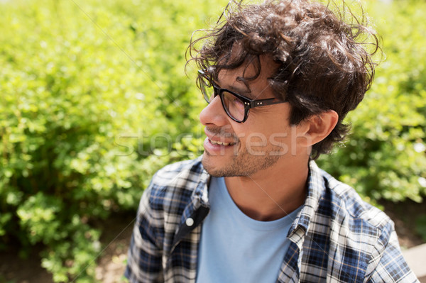 close up of smiling man in eyeglasses outdoors Stock photo © dolgachov