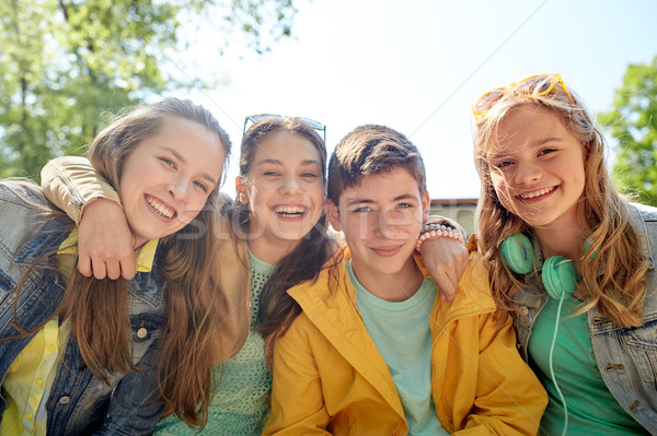 happy teenage students or friends outdoors Stock photo © dolgachov