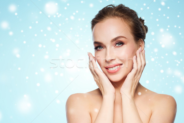 Belo mulher jovem tocante cara neve beleza Foto stock © dolgachov