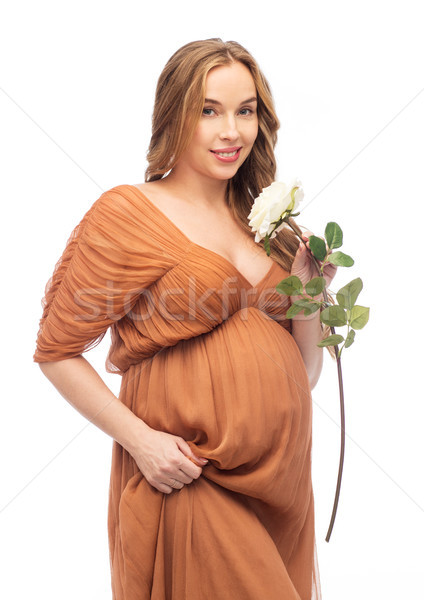 Felice donna incinta bianco rosa fiore gravidanza Foto d'archivio © dolgachov