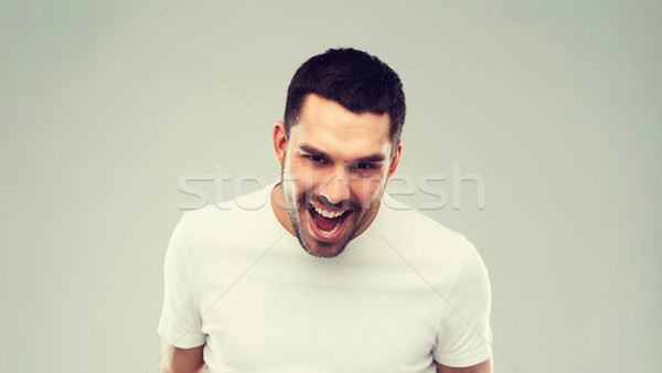 Supărat om gri emoţie cruzime furie Imagine de stoc © dolgachov