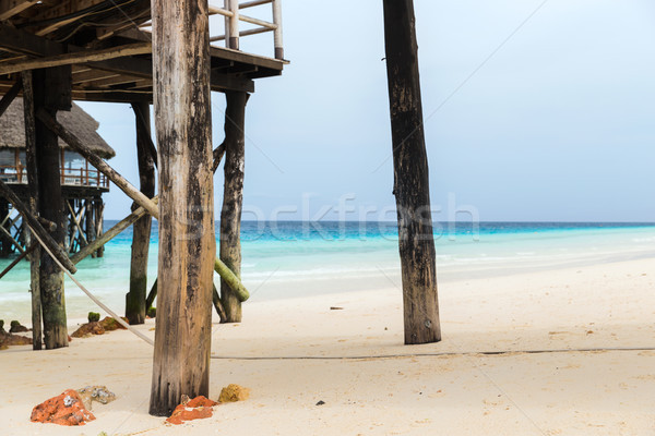 bungalows or stilt houses on tropical resort beach Stock photo © dolgachov
