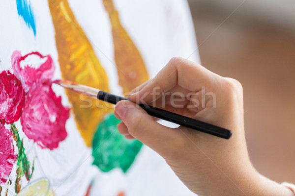 artist with brush painting still life picture Stock photo © dolgachov