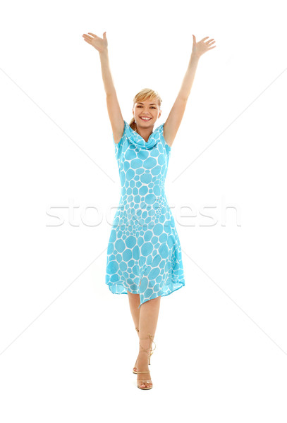 happy girl in blue dress with hands up Stock photo © dolgachov