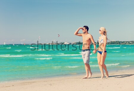 couple walking on the beach Stock photo © dolgachov