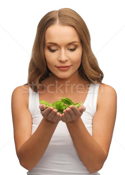 woman with spinach leaves on palms Stock photo © dolgachov