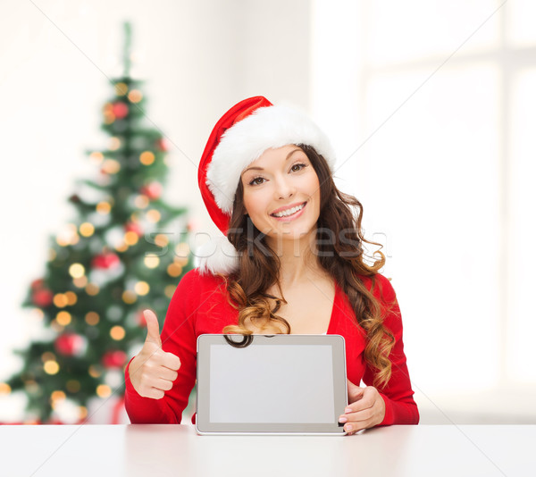 Nő mikulás segítő kalap táblagép karácsony Stock fotó © dolgachov