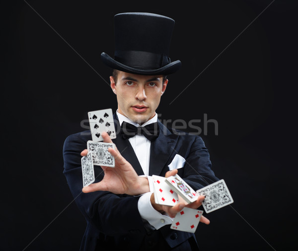 Magicien astuce cartes à jouer magie performances [[stock_photo]] © dolgachov