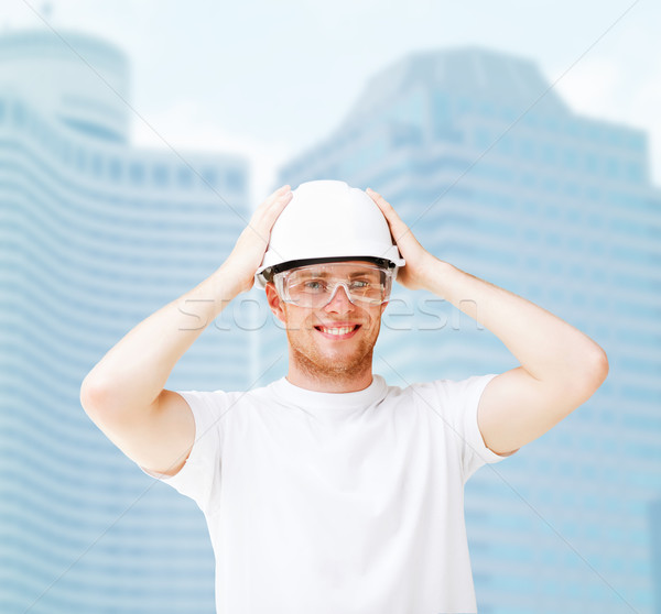 Masculino arquiteto capacete edifício em desenvolvimento Foto stock © dolgachov