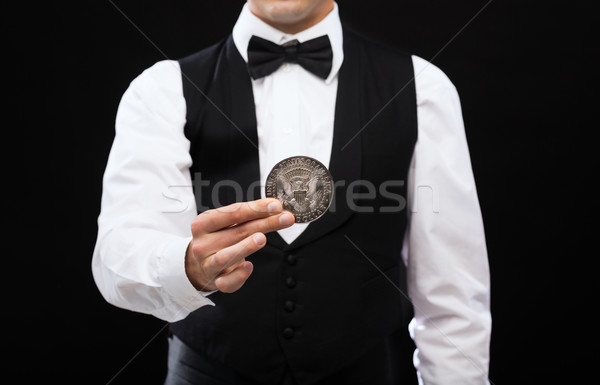 dealer holding half dollar coin Stock photo © dolgachov